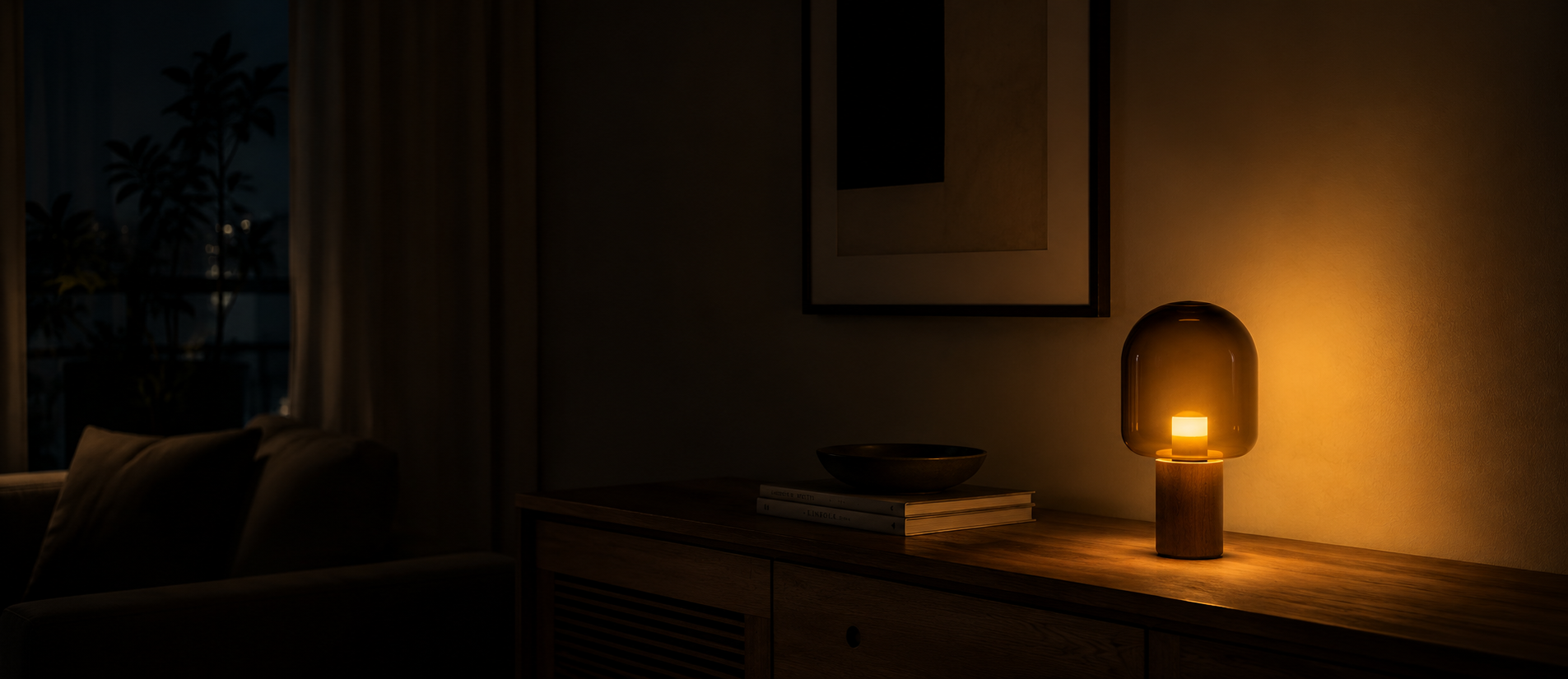 Warm amber table lamp casting soft light in a dark living room corner